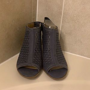 Two to three inch heels. Open toed. Blue/gray